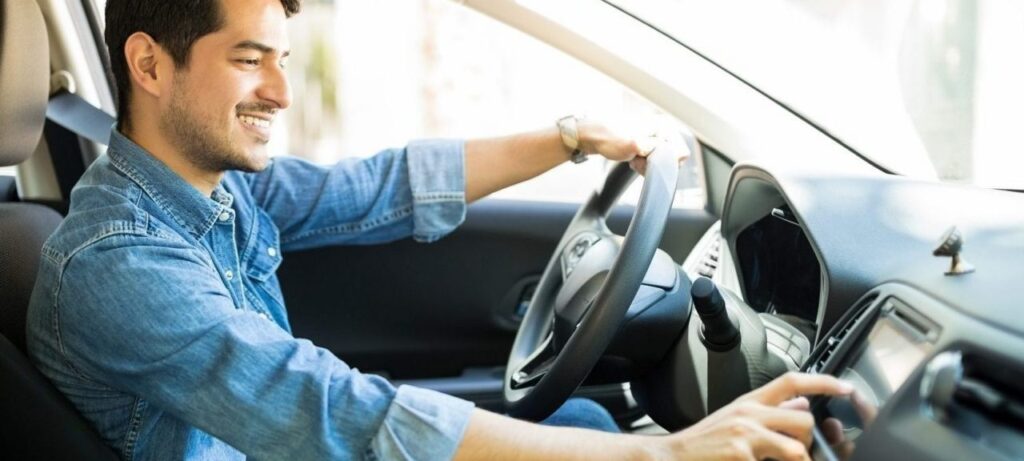 Driver seated inside of a car