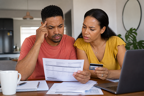 couple looking at credit card statement