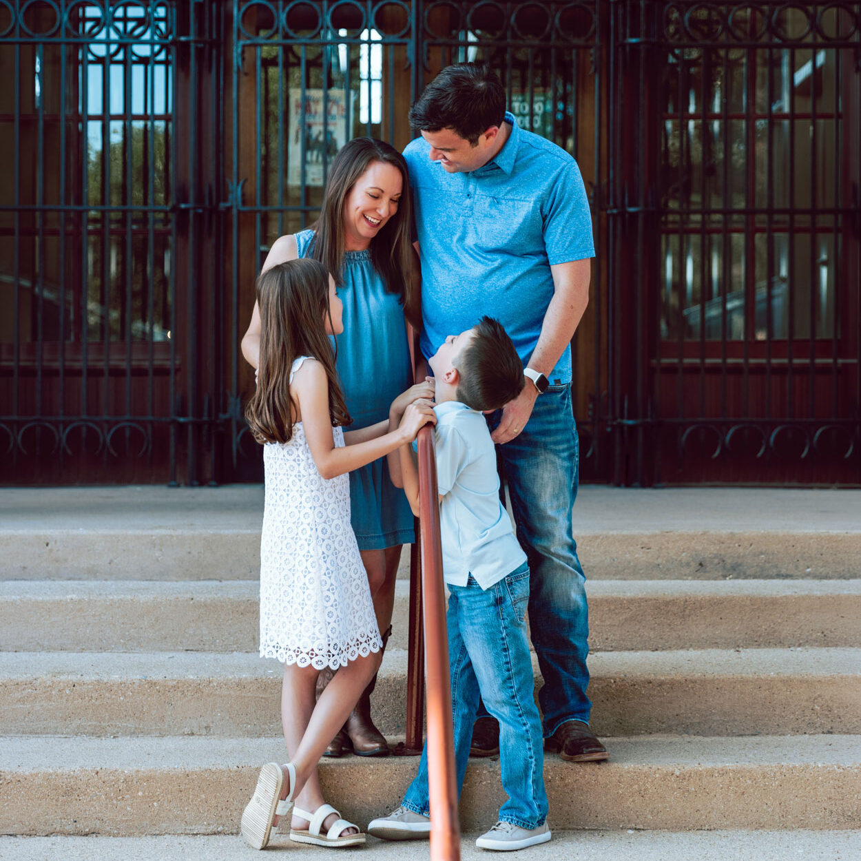 A family standing on a staircase